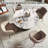 Round Table With Set Of Four Barrel Chairs-108053108-108053109-108053110