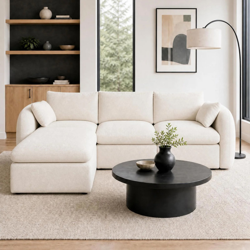 Canapé d'angle à compression, en mousse chenille blanc laiteux, style moderne et confortable.