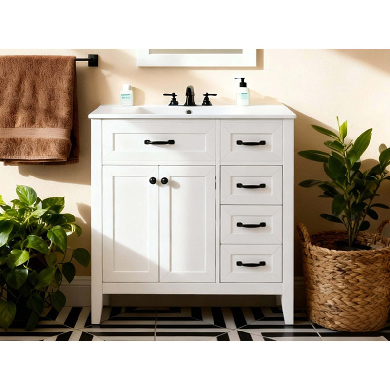Salle de bain avec lavabo encastré en céramique, armoire simple moderne avec tiroirs et portes