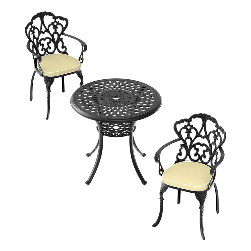 Confortables chaises de patio en fonte d'aluminium et table ronde avec coussins - meubles noirs à motifs rectangulaires exquis