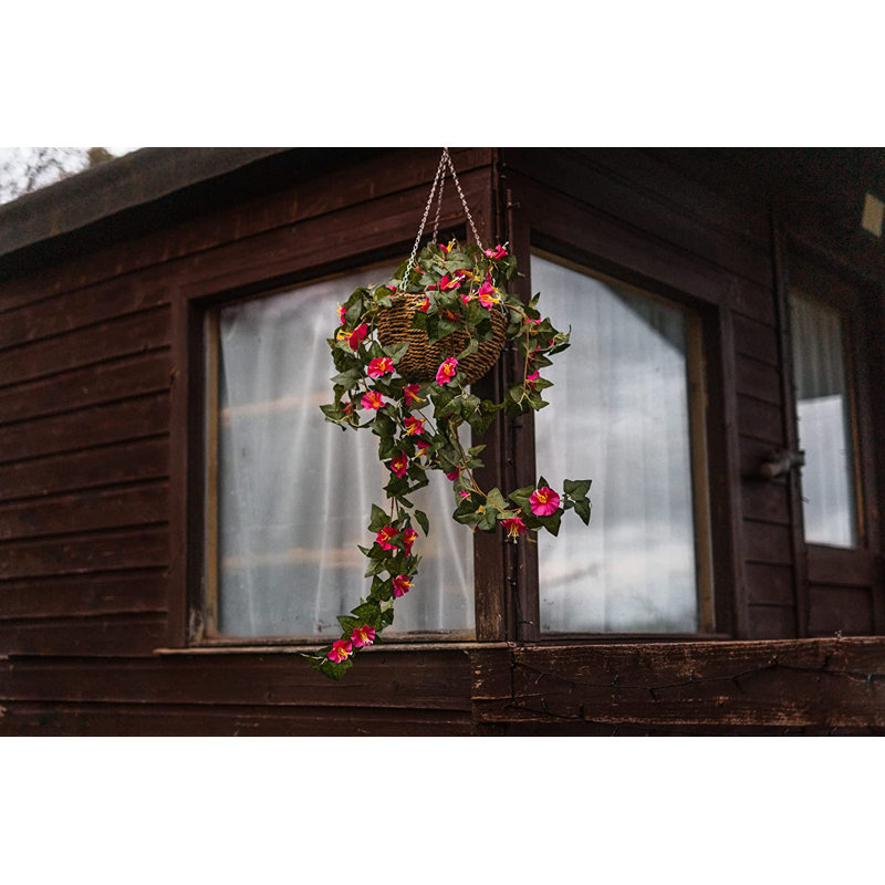 15cm Faux Flowering Plant in Wicker/Rattan Basket