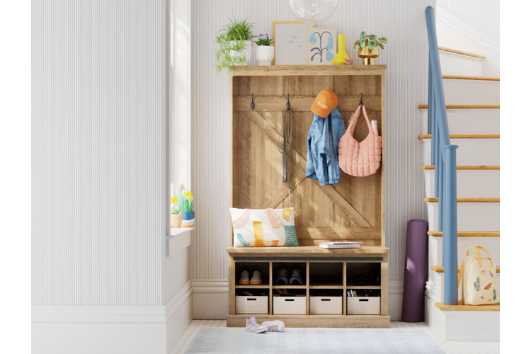 bright entryway with a wood hall tree, purple yoga mat, and plants