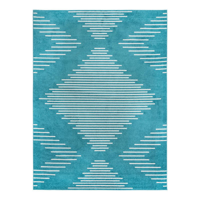 Tapis bleu à motif géométrique