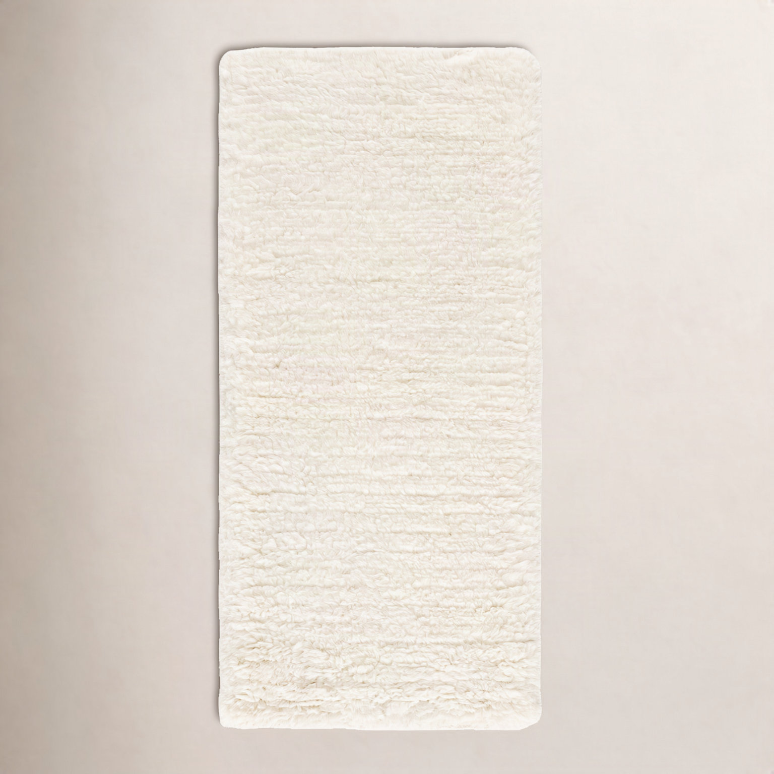 Abriel Ivory Solid Hand-Woven Wool Rug, Rectangle 2'3" x 5'