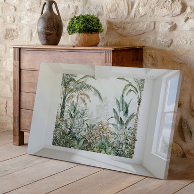 Toile une scène intérieure sereine avec une magnifique murale illustrée d'un feuillage tropical sur un mur blanc