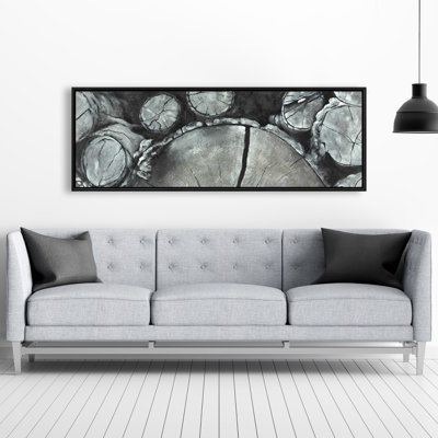 Bûches de bois empilées - décor de toile encadrée gris