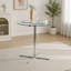 Table de bar ronde en verre avec base chromée pour petits espaces