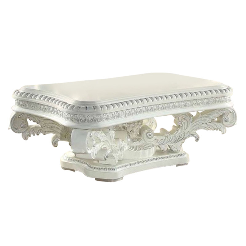 Kin 55" White Ornate Wood Coffee Table with Scrolled Pedestal