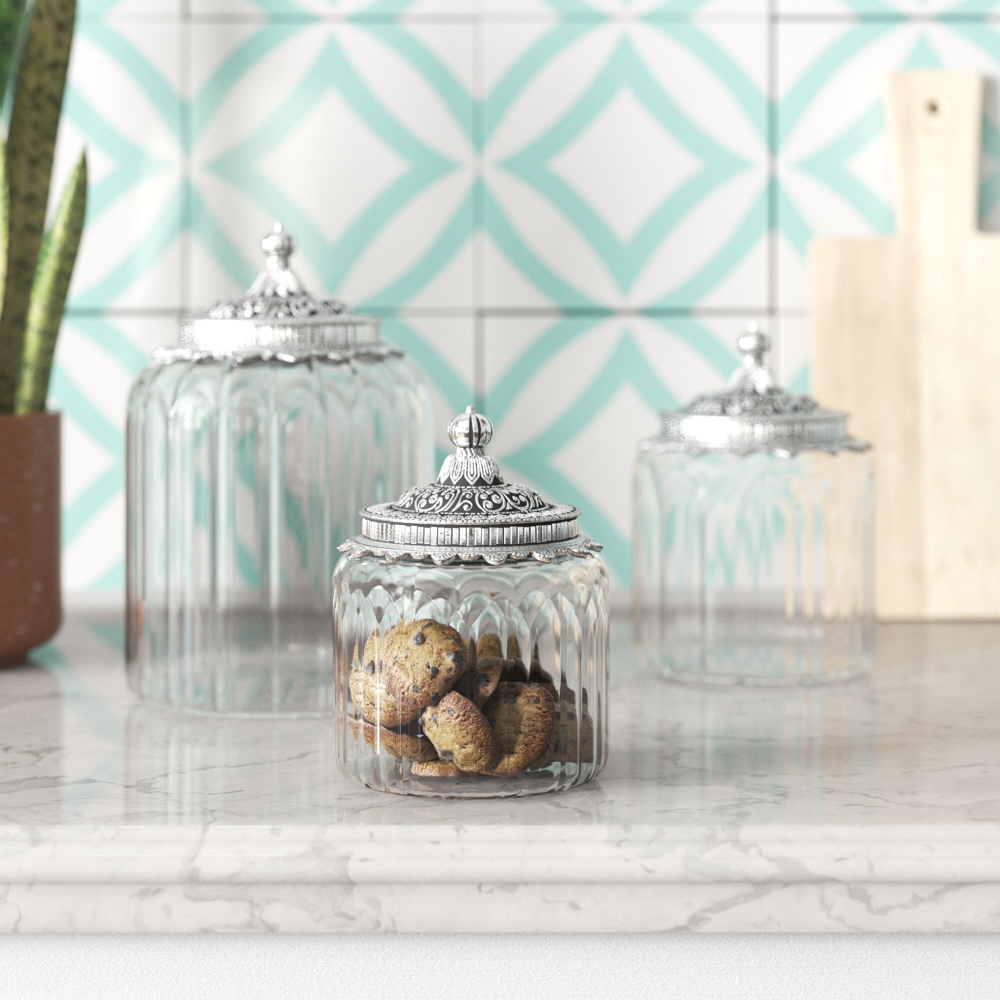 https://assets.wfcdn.com/im/98709682/compr-r85/1682/168274152/3-pieces-clear-glass-decorative-jars-with-engraved-silver-lids-6-7-9-h.jpg