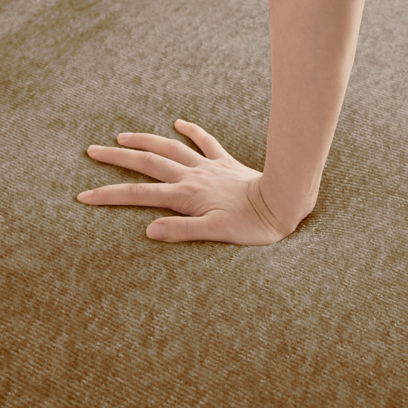 Repose-pieds en velours brun