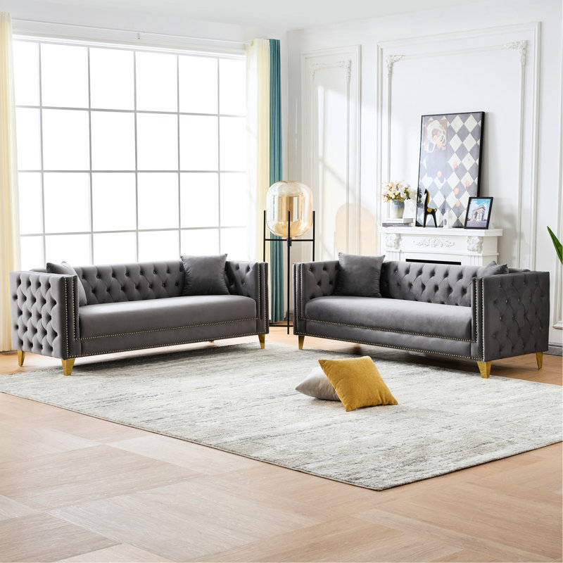 Canapé Chesterfield confortable en velours au design traditionnel et élégant, parfait pour le salon
