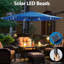 Parasol de patio bleu à DEL 11 pieds avec 8 nervures, imperméable et résistant à la décoloration, inclinable pour l'éclairage des espaces extérieurs, manivelle manuelle