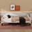 A Full-Size Upholstered Daybed With Tufted Detailing