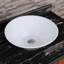 Lavabo de salle de bain rond en céramique