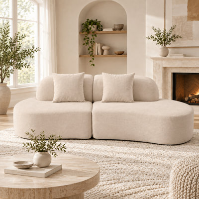 Canapé modulaire incurvé moderne à assise profonde avec revêtement en peluche éponge pour salon