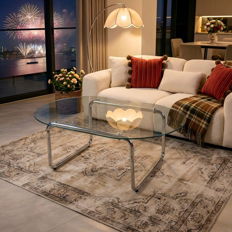 Table basse moderne minimaliste avec dessus incurvé en verre trempé transparent et pieds en métal chromé, table d'appoint élégante pour salon