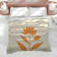 Édredon orange à motif floral-128700569