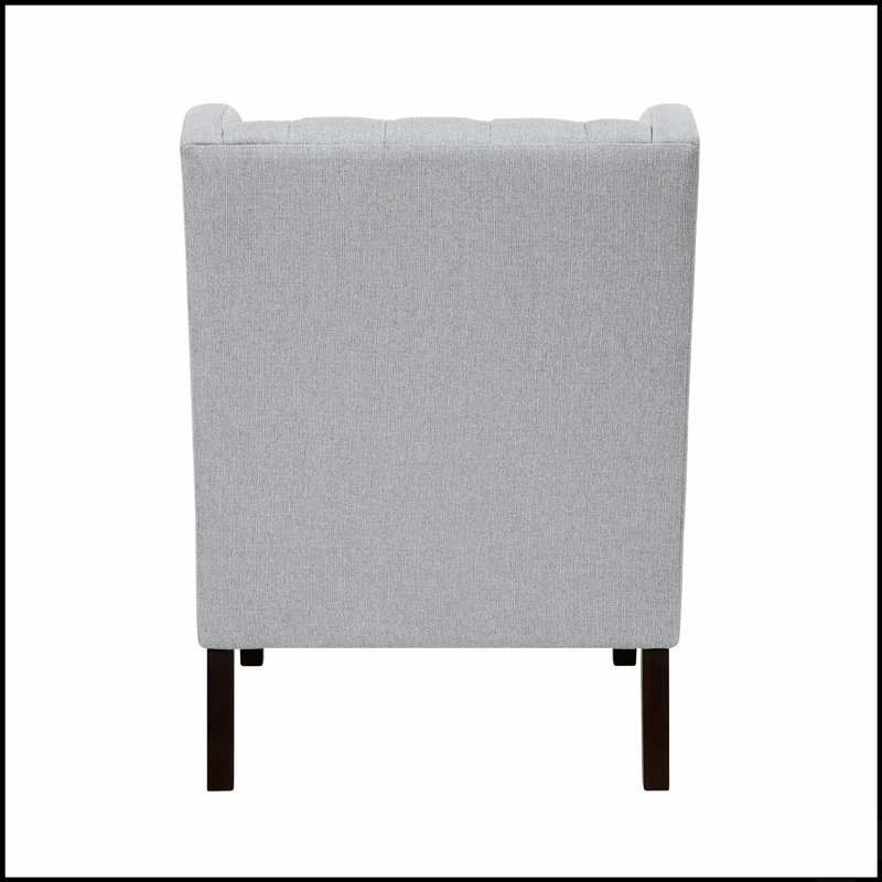 Fauteuil d'appoint élégant à boutons capitonnés et coussin en mousse confortable, idéal pour rehausser la décoration de n'importe quel salon.