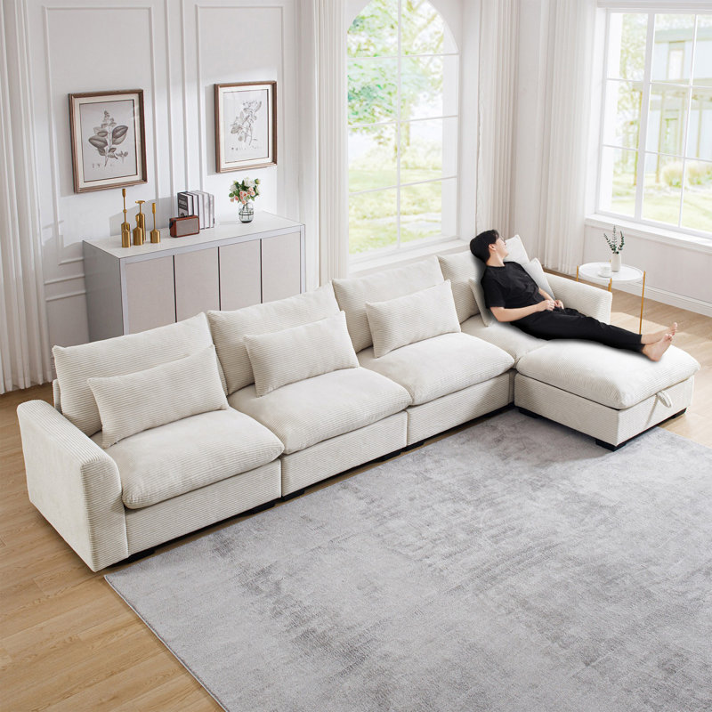 Grand canapé modulaire en forme de L avec repose-pieds avec rangement et 4 coussins de taille