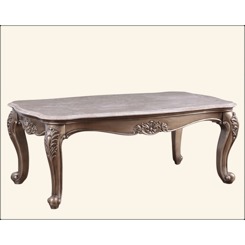 Table basse avec plateau en marbre et finition champagne