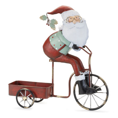 Père Noël fantaisiste faisant du vélo