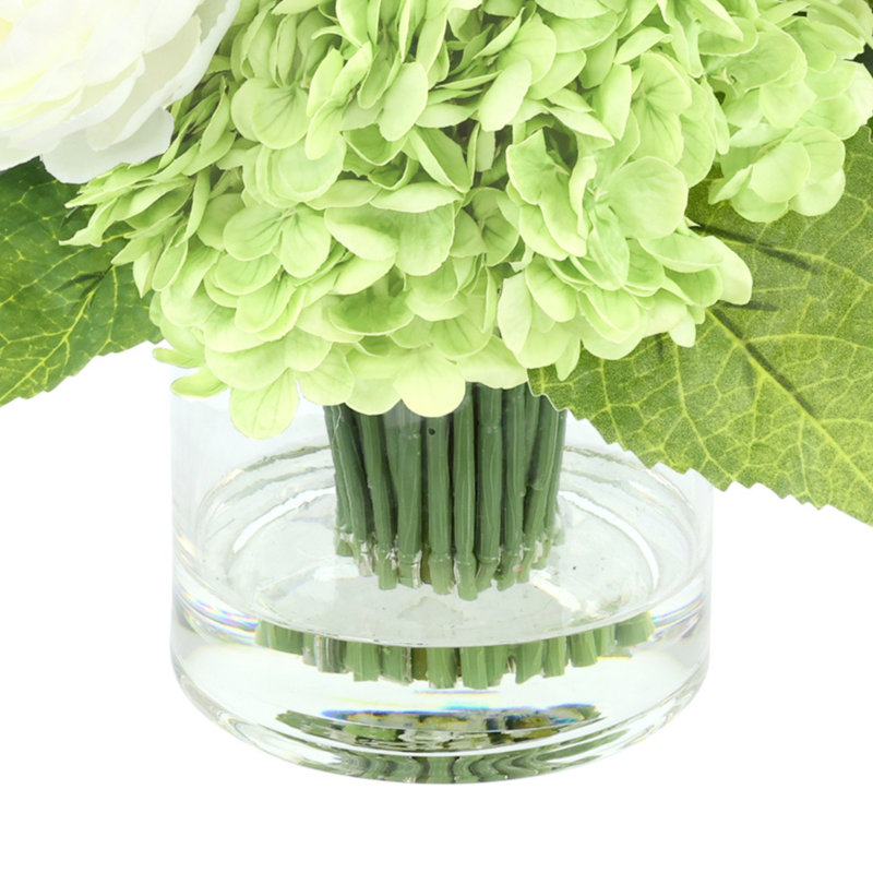 Ranuculus, Hydrangea and Grass Arranged in a Glass Vase