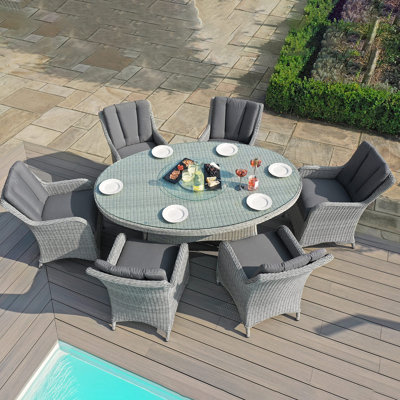 Crimora 6 - Person Patio Dining Set Umbrella Hole Included Oval Table with Cushions Included