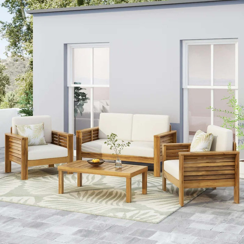 Ensemble de causeuse et table basse en teck et bois d'acacia avec coussins
