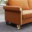 Mobilier de salon en velours orange avec pieds en métal doré et coussins profonds élégants