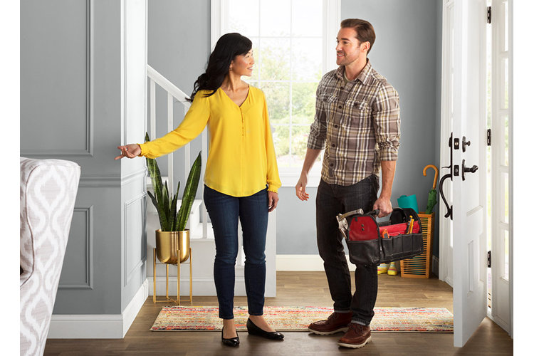 homeowner speaking with a contractor in her home