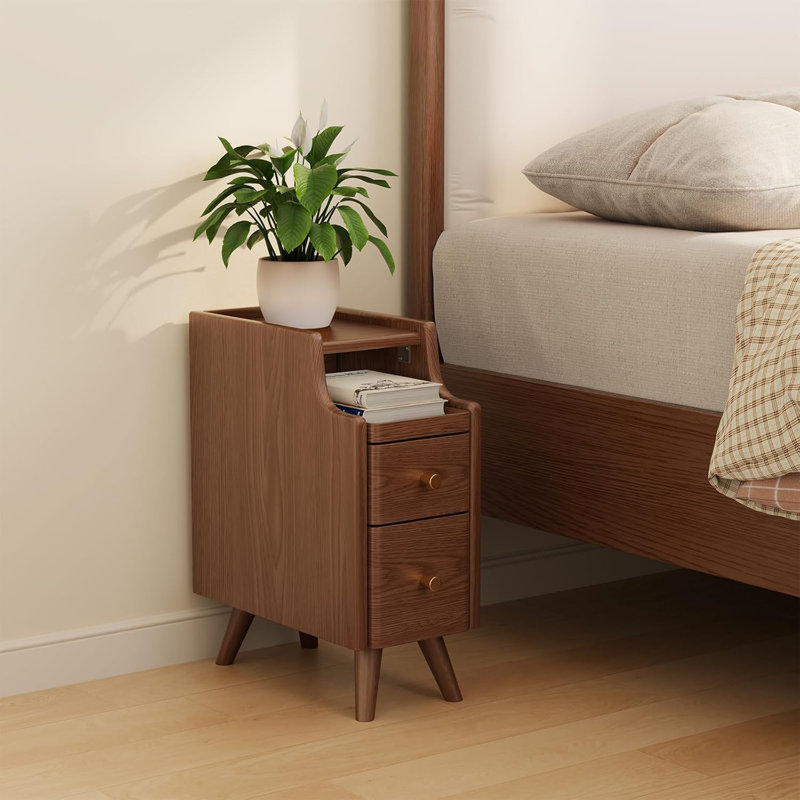 A Small Bedside Table With Drawers