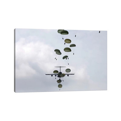 Army Soldiers Jump Out Of A C-17 Globemaster III by Stocktrek Images - Wrapped Canvas Print