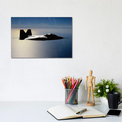 An F/A-22 Raptor Flies A Training Mission II by Stocktrek Images - Wrapped Canvas Print