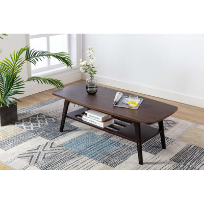 Coffee Table With Solid Wood Legs And Open Shelf by George Oliver