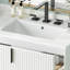 Meuble-lavabo blanc de 76 cm (30 po), lavabo en céramique, tiroirs à fermeture amortie, extérieur cannelé et rangements bien pensés. Meuble-lavabo blanc de 76 cm (30 po), équipé d'un comptoir, d'un mécanisme et d'un style complets.