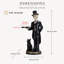 Statue squelette avec plateau de majordome et chat noir