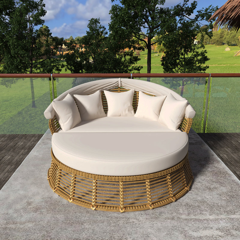 Lit de jour rond en rotin d'extérieur beige avec auvent rétractable et coussins amovibles