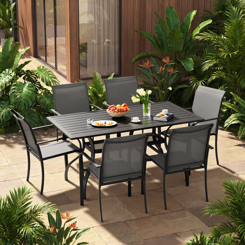 Ensemble de salle à manger de patio pour 6 personnes avec table de salle à manger rectangulaire en métal et fauteuils empilables en textilene Behrens