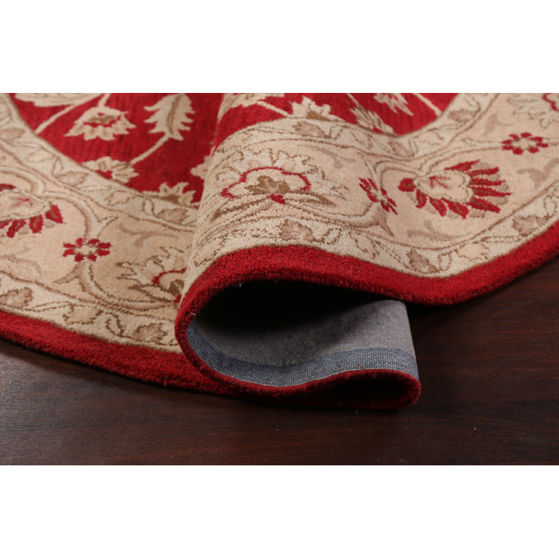 Tapis rond rouge / beige en laine touffeté à la main