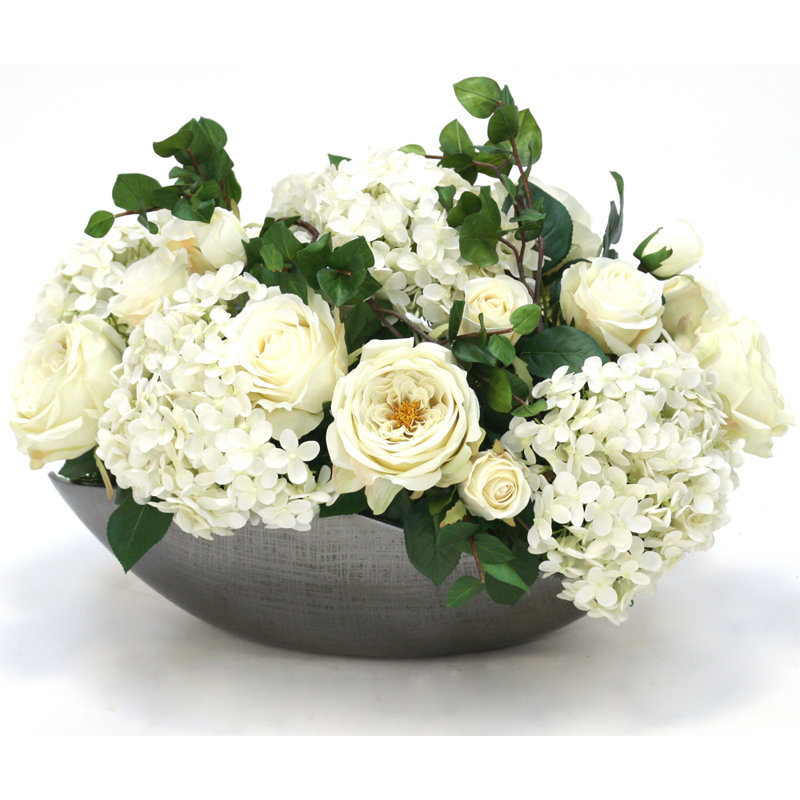 Arrangement floral mixte dans un pot décoratif