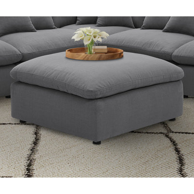 Carré gris anthracite avec revêtement, sans dossier et sans accoudoirs, coutures sur mesure de conception moderne, tissu profond de 38 pouces, lignes à détails précis, pour y poser les pieds, 19 pieds de hauteur