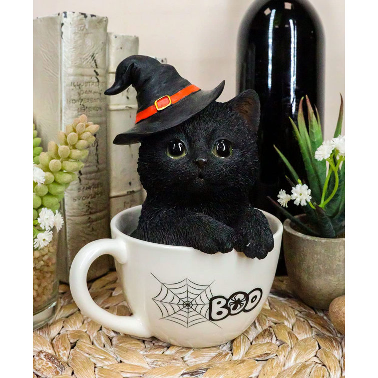 Handmade ceramic mug with witch cat design and a super cute magic