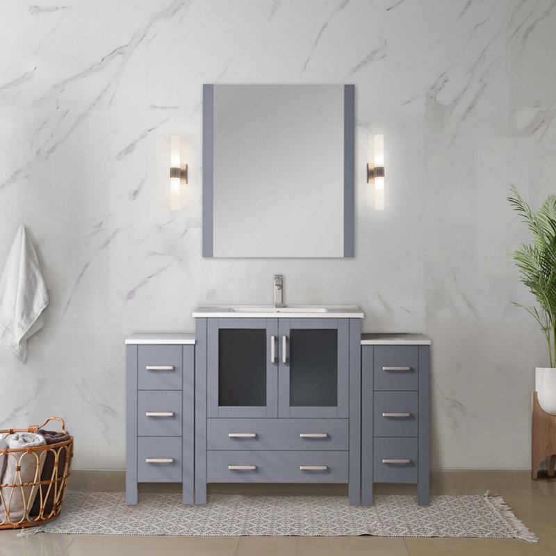Ensemble de meuble-lavabo simple avec armoires latérales, comptoir en céramique blanche et robinet