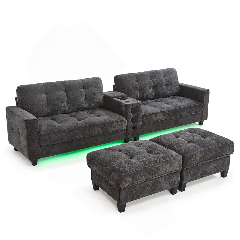 Canapé modulaire moderne en forme de U avec repose-pieds, console, haut-parleurs Bluetooth et lumières DEL pour le confort et le divertissement du salon.