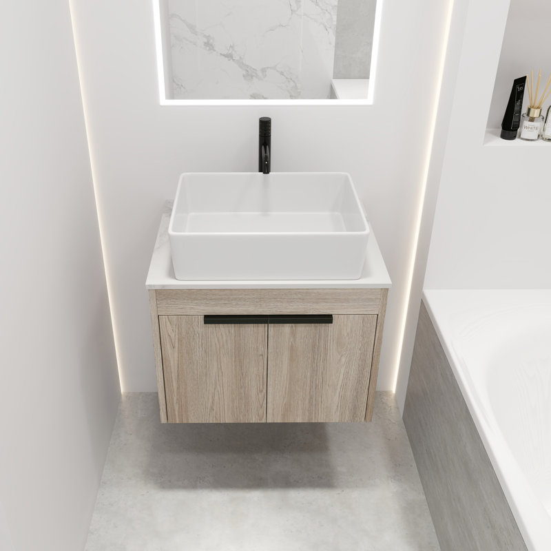 Meuble-lavabo moderne de 24 po. Chêne blanc mural avec lavabo en céramique. Porte à fermeture en douceur et rangement intérieur généreux. Lavabo en chêne. Armoires de rangement abondantes.