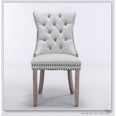 Chaise de salle à manger haut de gamme rembourrée en bois massif et capitonnée avec pieds en bois robustes, parfaite pour les sièges élégants et confortables.