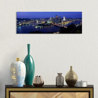 Buildings Along A River Lit Up At Dusk, Monongahela River, Pittsburgh, Allegheny County, Pennsylvania, USA - Wrapped Canvas Panoramic Print
