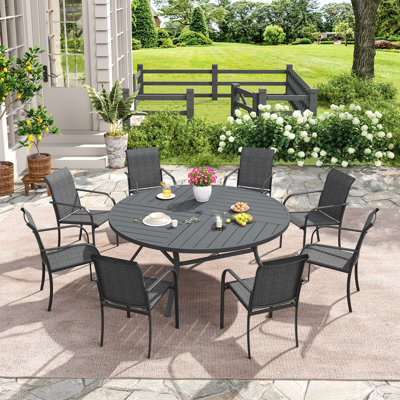 Bustamante Outdoor Round Patio Dining Set with Stackable Textilene Chairs