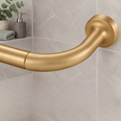 This warm gold wrap-around window curtain rod adjusts from 28 to 56 inch and uses internal splicing with a 1 inch diameter disc; the room-darkening design includes aluminum finials and brackets.