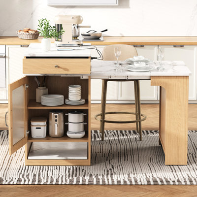 Îlot de cuisine de 151 cm (59,5 po) avec plateaux amovibles, rallonge de 26 à 106 cm (10,2 à 41,8 po), compartiment de rangement latéral et accès à une prise de courant. Extensible selon vos besoins, fonctionnel et double face.